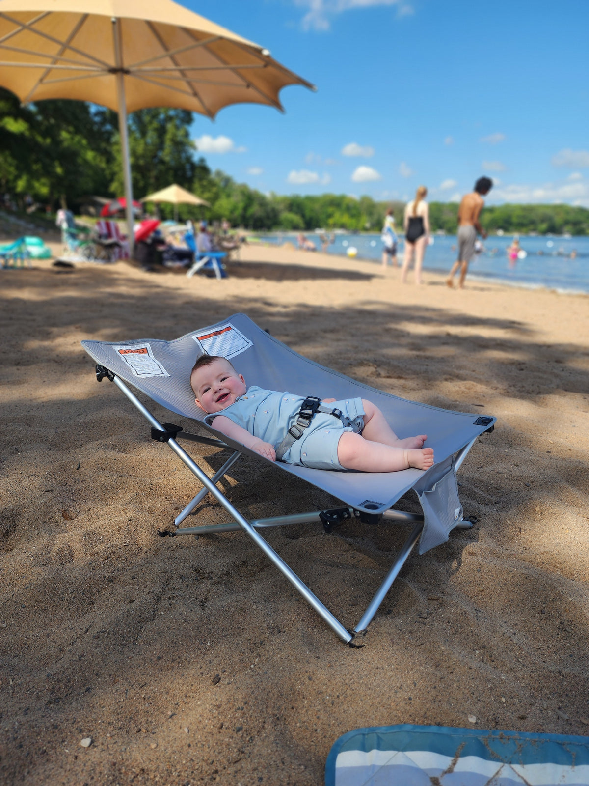 The Breezy Baby portable infant outdoor chair with full shade canopy